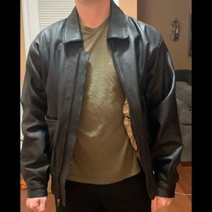 Black leather zip front jacket. Size XL.